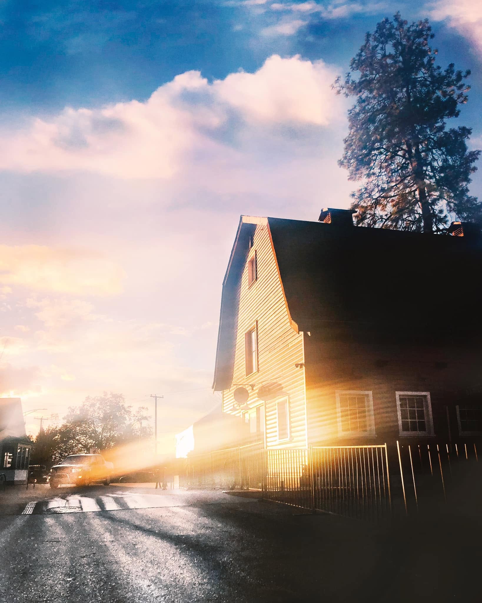 The gable end of the Barn Owl Brewing building caught in low evening sun from across the road.