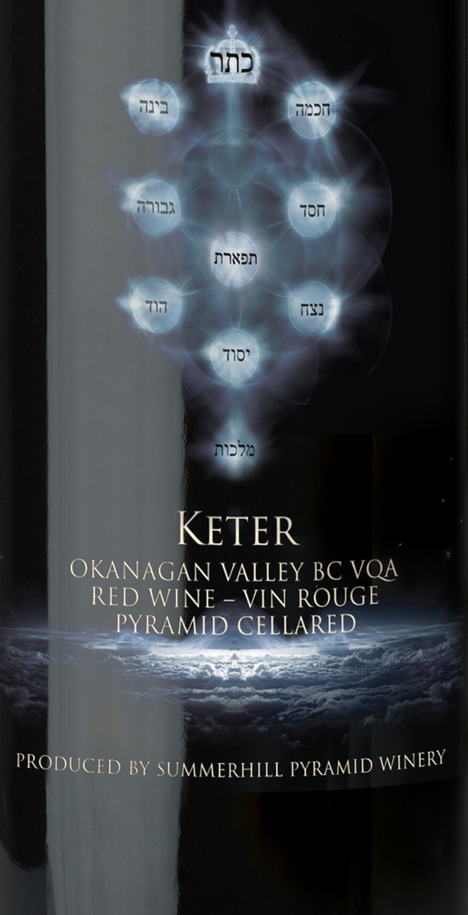 The Keter label in full: the ten sefirot of the Tree of Life rendered as points of light and lettered in Hebrew, the wine's name and appellation beneath, and a pyramid glowing on the horizon at the foot of the label.
